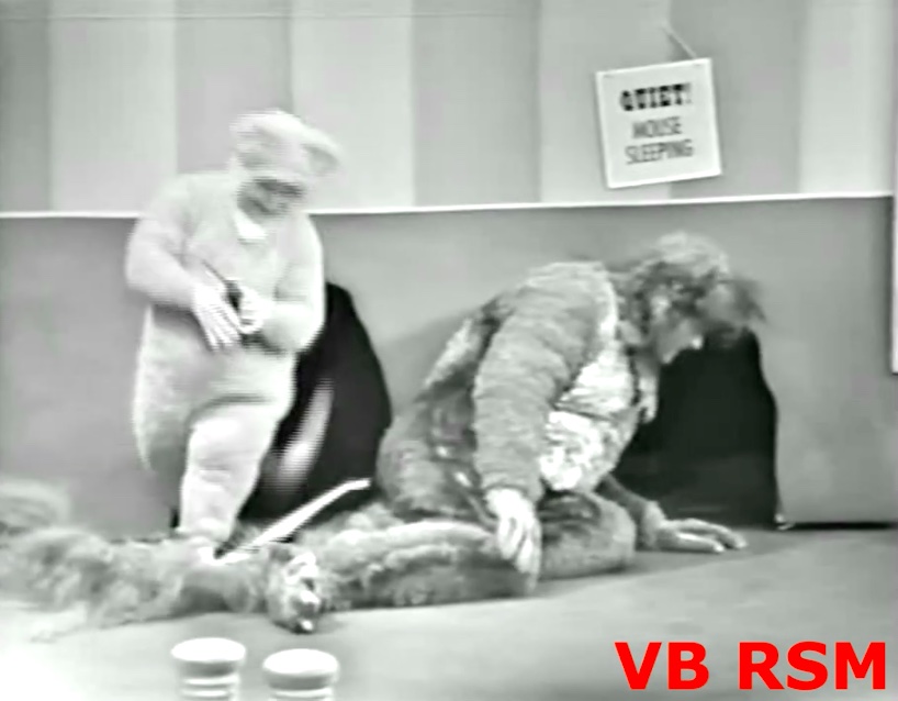 Mouse (Billy Barty) sneaking up behind the Cat (Red Skelton)