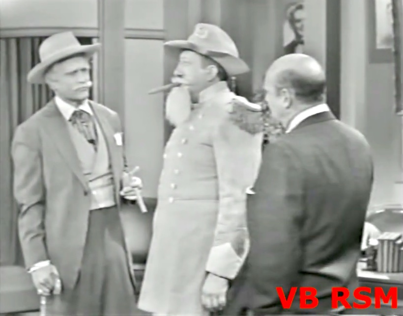 San Fernando Red tries to supply a southern actor (Henry Corden) to movie studio owner Joe Passabuck (Jackie Coogan)