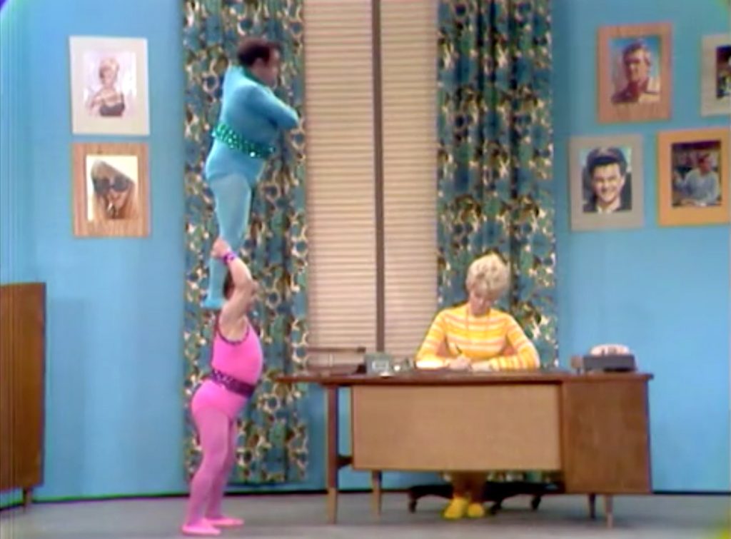 Acrobats audition at San Fernando Red's Talent Agency, as Ruby (Pat Priest) watches