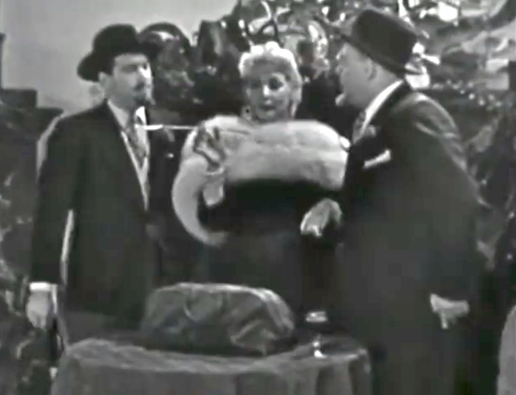 Fraulein Helga (Ann Sothern) and her spies conspiring to steal Flugelmeyer's Secret Formula
