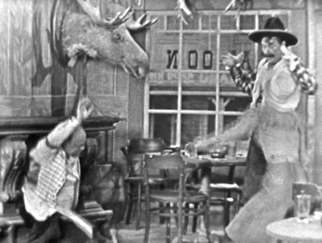 Bartender and Emmy Lou try to kill Deadeye - but hit each other!