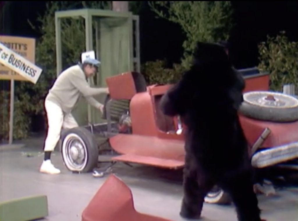 Tearing the car apart to use in a slapstick battle between Red Skelton and the bear!