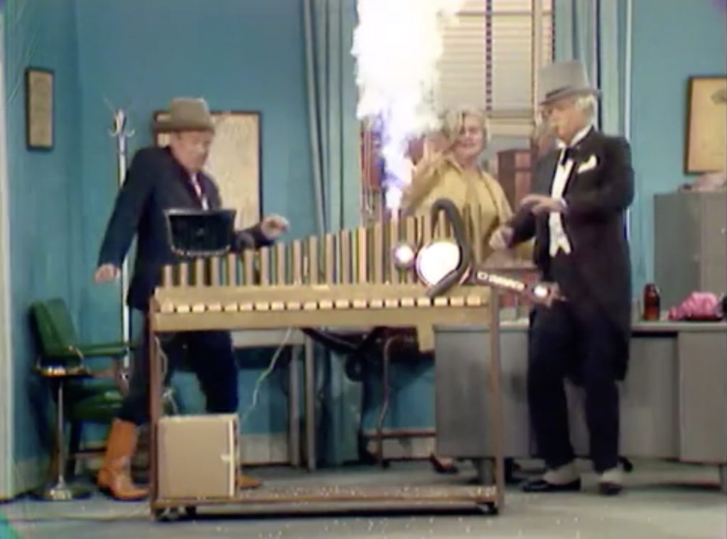 San Fernando Red "demonstrates" his bogus rain machine to Arthur Godfrey and Ruby (Joan Shawlee) in "Little Old Rainmaker, He"