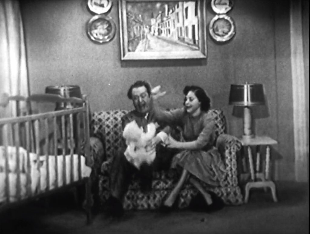 Red Skelton bouncing the baby on his knee *very* energetically in Rock-A-Bye Baby
