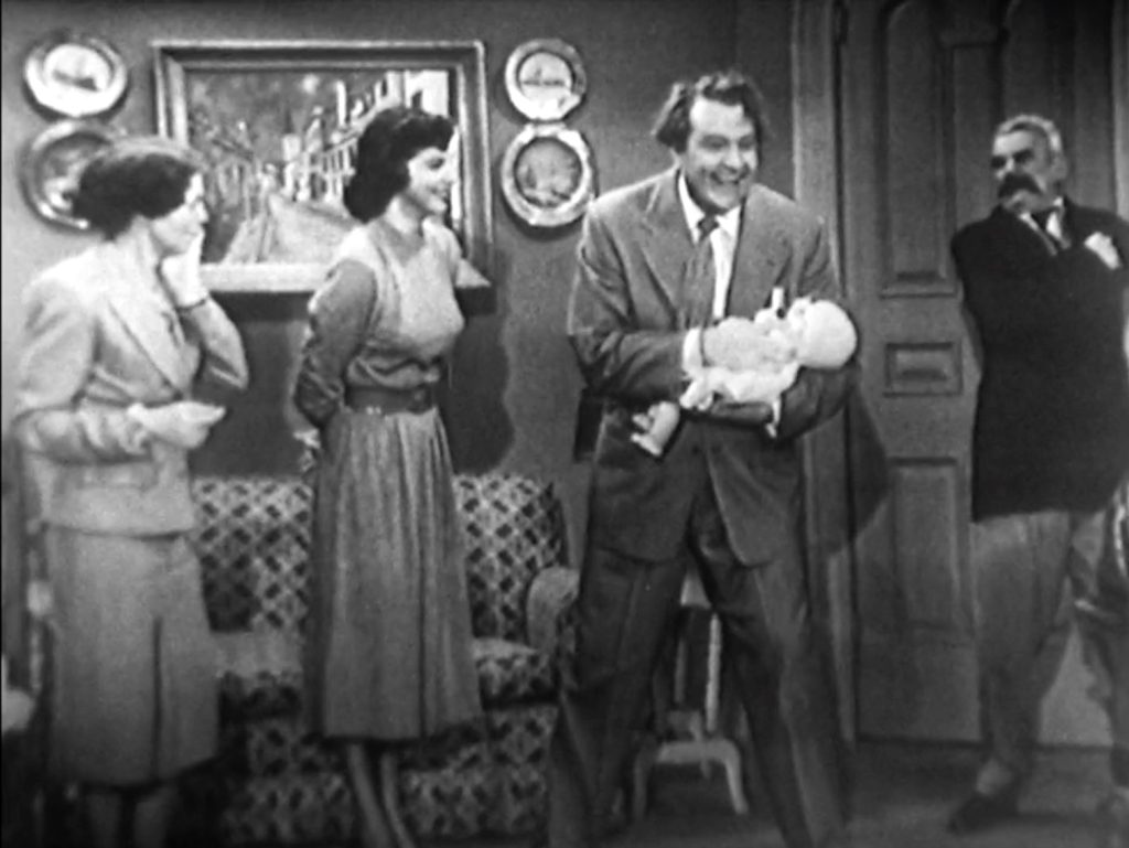 Red Skelton and his fictional family with the broken baby doll in the Rock-A-Bye Baby segment