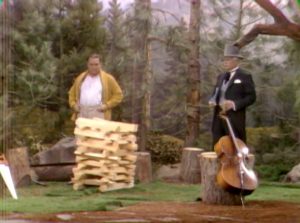 Humphrey T. Humble demonstrates his rapid tree clearing skill to San Fernando Red at the lumber camp in "Goodbye Mr. Gyp"