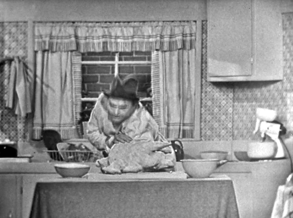 Clem Kadiddlehopper's arm all the way into the turkey!