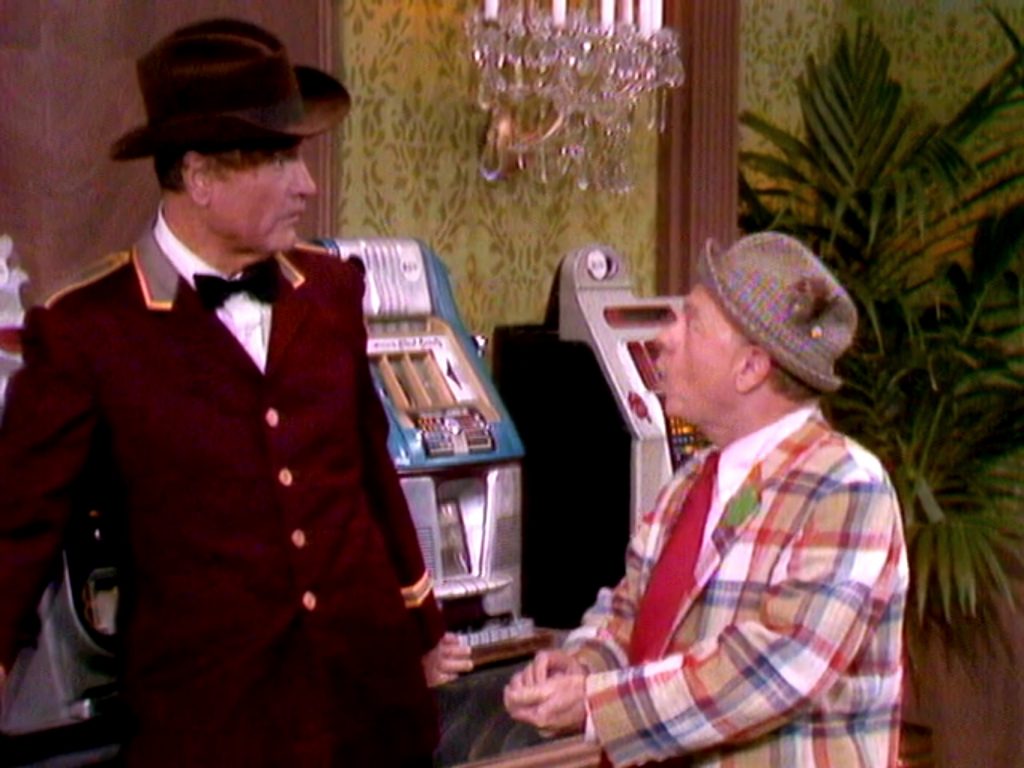 Clem Kadiddlehopper "helping" Mickey Rooney at the slot machines in Eenie Meenie Minee Schmo