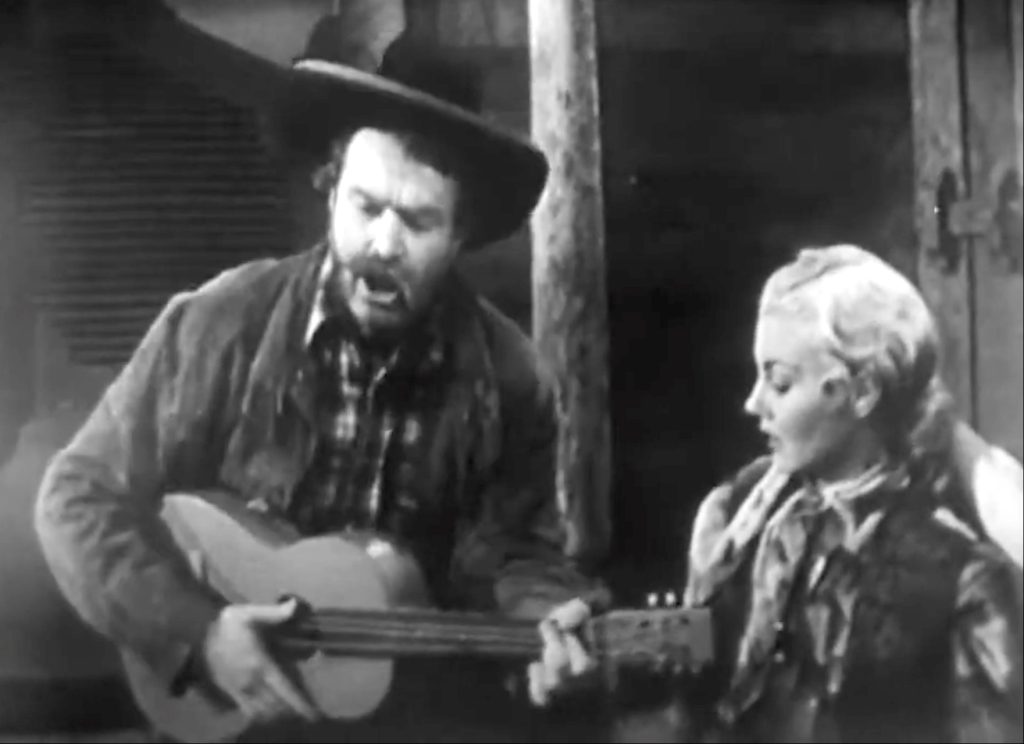 Deadeye sings "The Streets of Laredo" to his dying opponent - but the sheet's too dirty!