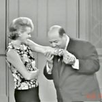 Child psychologist (Stubby Kaye) kissing Mrs. Cavendish (Janis Paige) on her jewelry in "Ten Little Fingers and Twelve Little Toes"