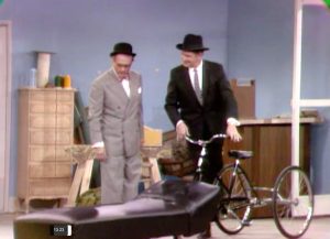 Door to door psychiatrist (Vincent Price) comes into the shop where George Appleby (Red Skelton) works, in "The Agony and the Nag-Ony"