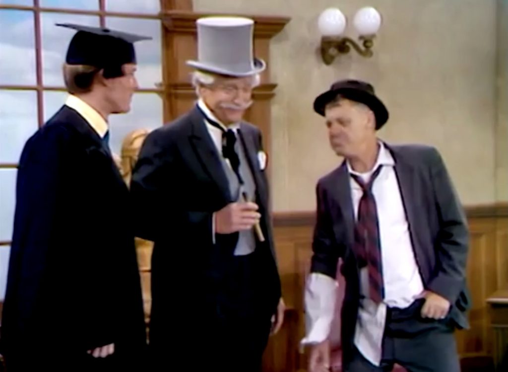 Lawyer Clarence Narrow (Richard Chamberlin), San Fernando Red, and the drunk (Jimmy Cross) in the courtroom in "It's a Treat to Beat a Cheat on the Mississippi Mud"