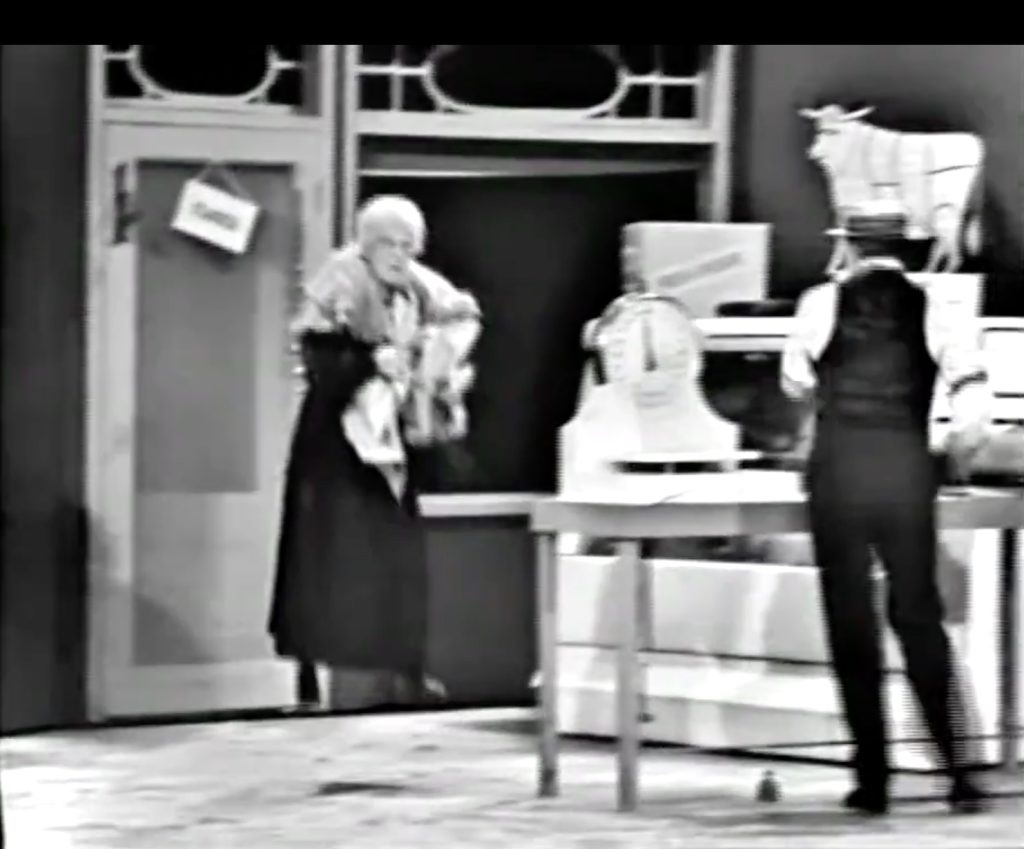 Poor David Sharpe gets carried away in Red Skelton's butcher shop