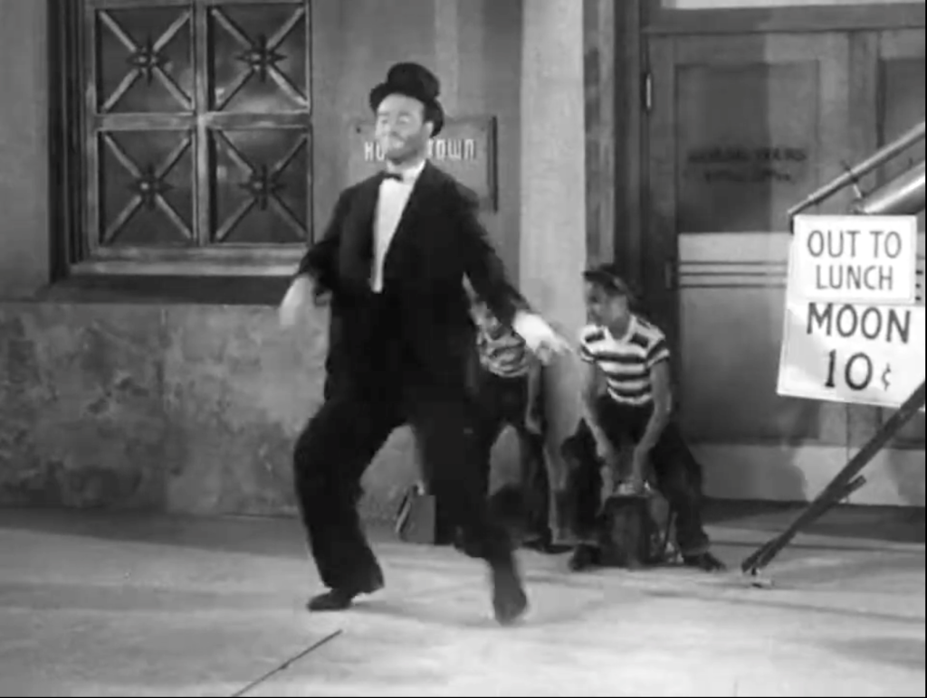 The Moultrie Brothers, as shoeshine boys, demonstrating their dancing skills