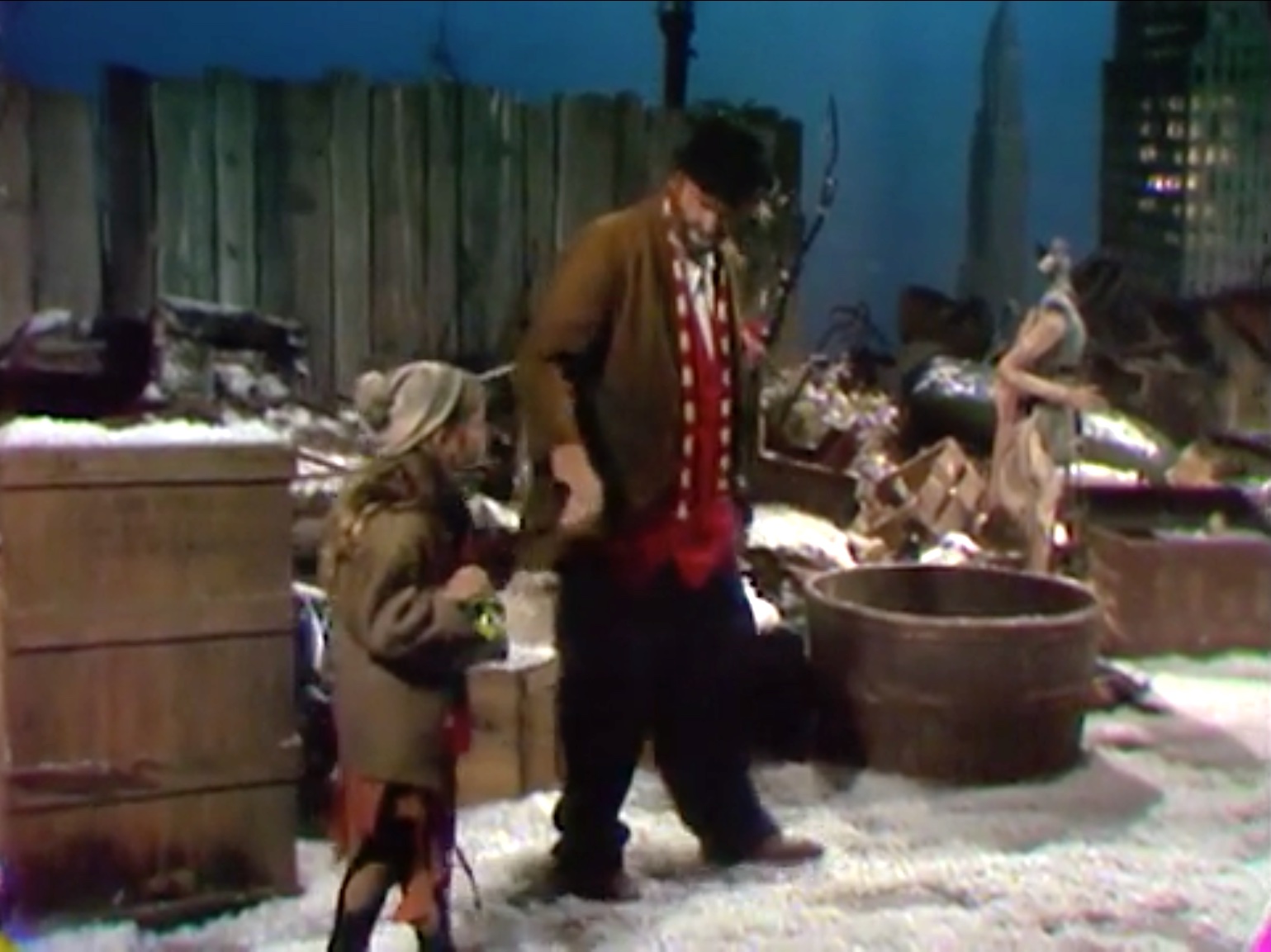 Freddie the Freeloader finds the Christmas urchin outside his shack