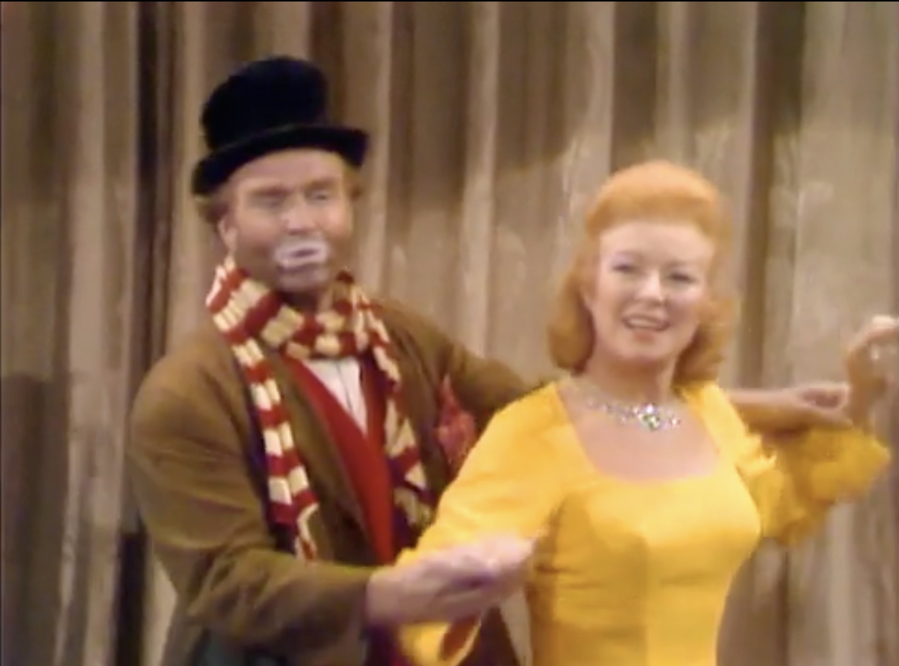 Freddie the Freeloader and Greer Garson dance onstage in "The Christmas Spirit"