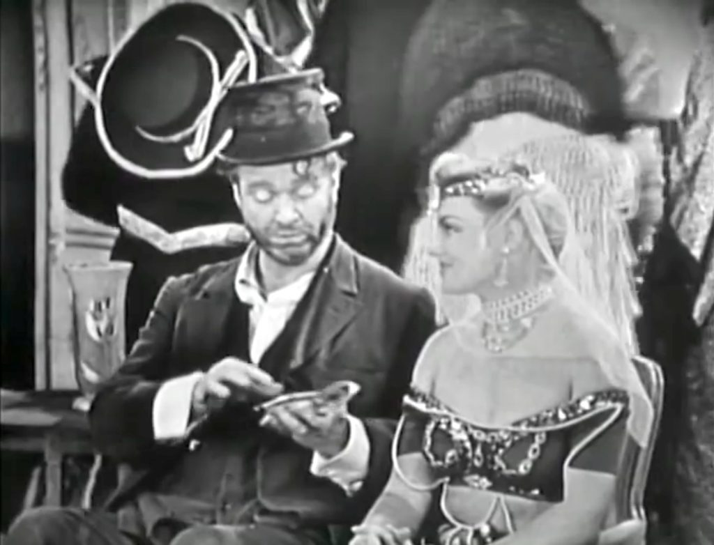 Freddie the Freeloader and the harem girl at the party