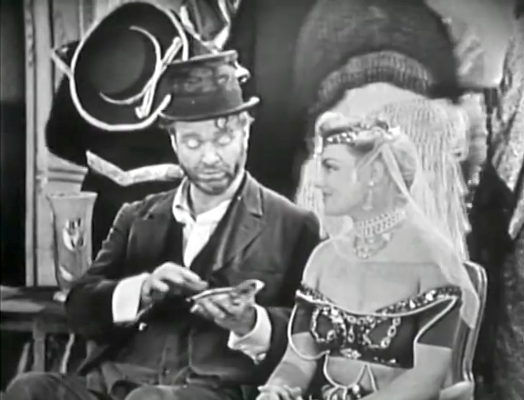 Freddie the Freeloader and the harem girl at the party
