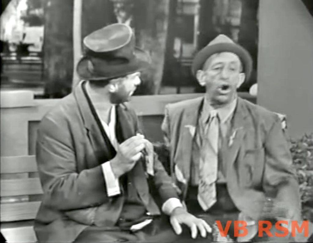 Freddie the Freeloader and Muggsy on the park bench in "The Mayor of Central Park"