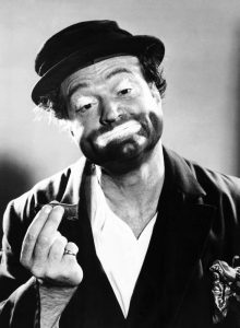 Red Skelton as Freddie the Freeloader, holding a cigar