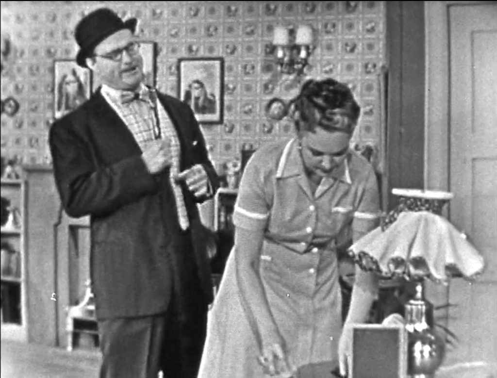 George Appleby telling tall tales, which his wife ignores