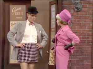 George Appleby models one of his company's mini-skirts.  His wife Clara is not amused in "Better Dead than Wed"