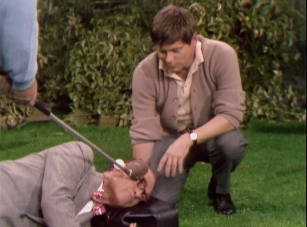 Dr. Harvey Butterfingers (Robert Morse) on the golf course with George Appleby (Red Skelton).in Somebody Down Here Hates Me