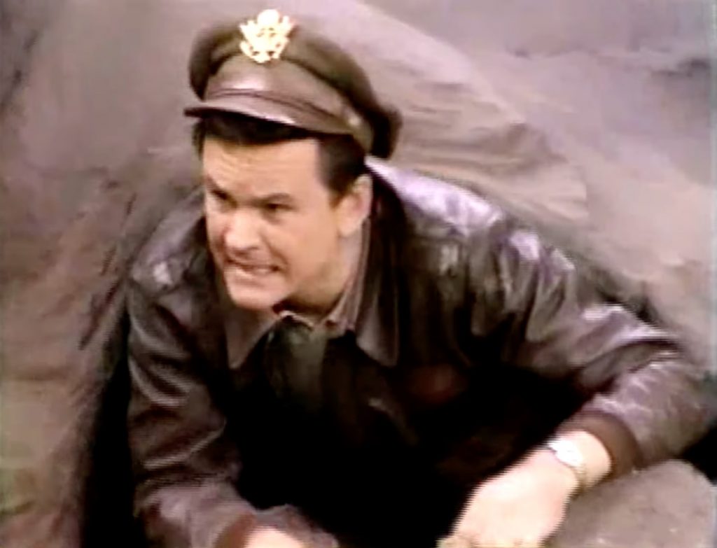 Bob Crane as Colonel Hogan, escaping from Stalag 13 in "How You Gonna Keep 'Em Down in the Dump"