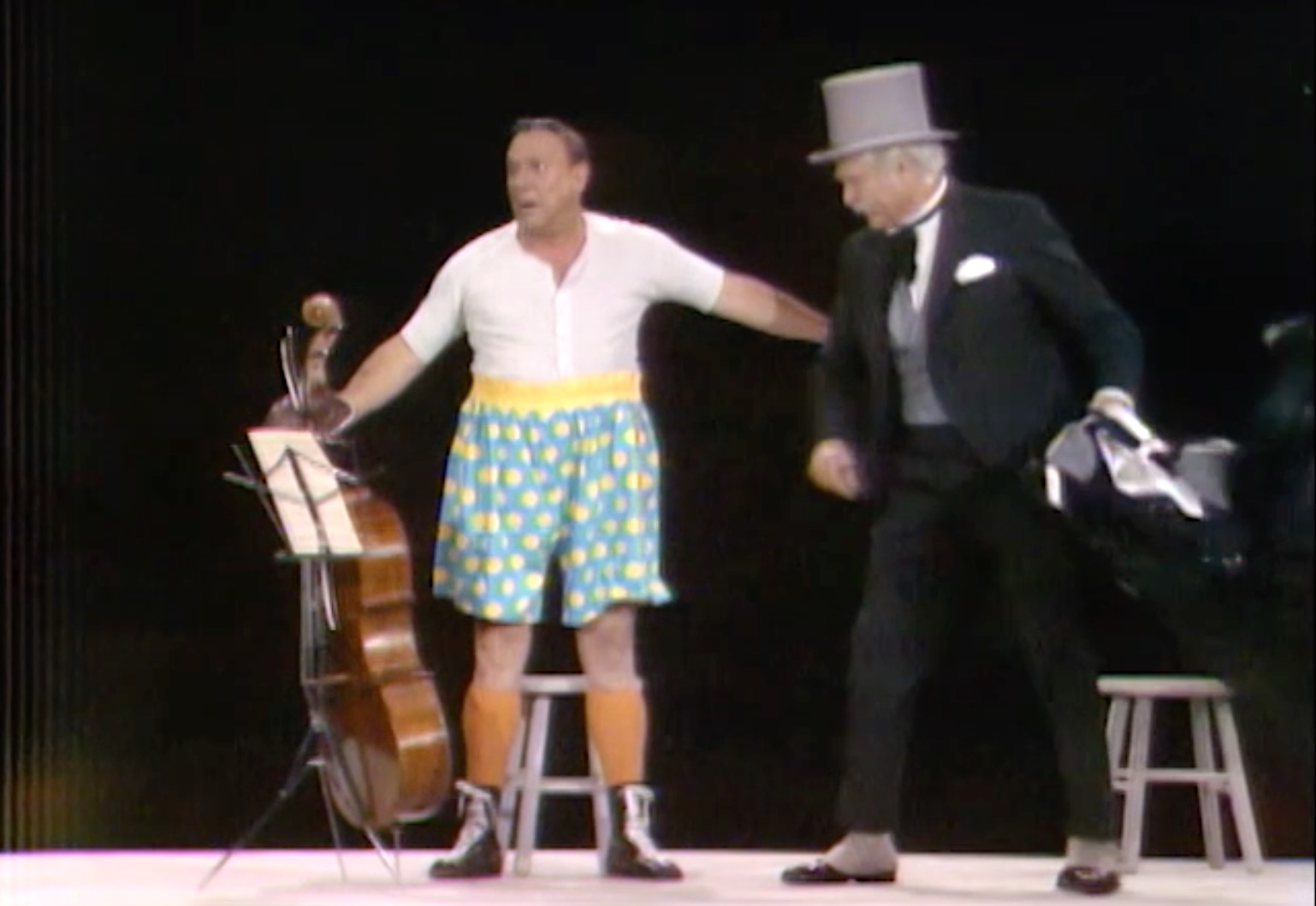 Humphrey T. Humble (Jackie Coogan), cellist, tricked into Madison Square Garden by San Fernando (Red Skelton) in "Goodbye Mr. Gyp"
