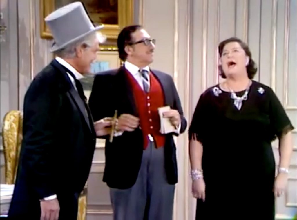 San Fernando Red arrives to help the wealthy couple cheat on their taxes - and insult the wife!