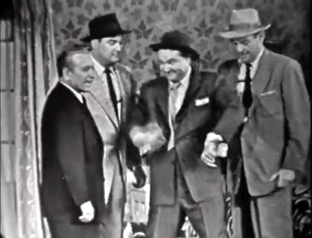 Mr. Lasagna (George Raft) tries rough stuff on Red Skelton