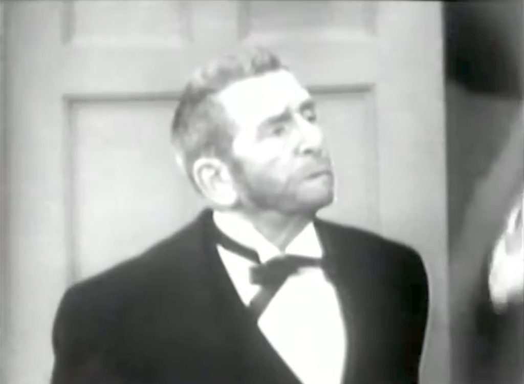 Smitty (Edward Everett Horton) dresses as a butler and tries to convince the cop …