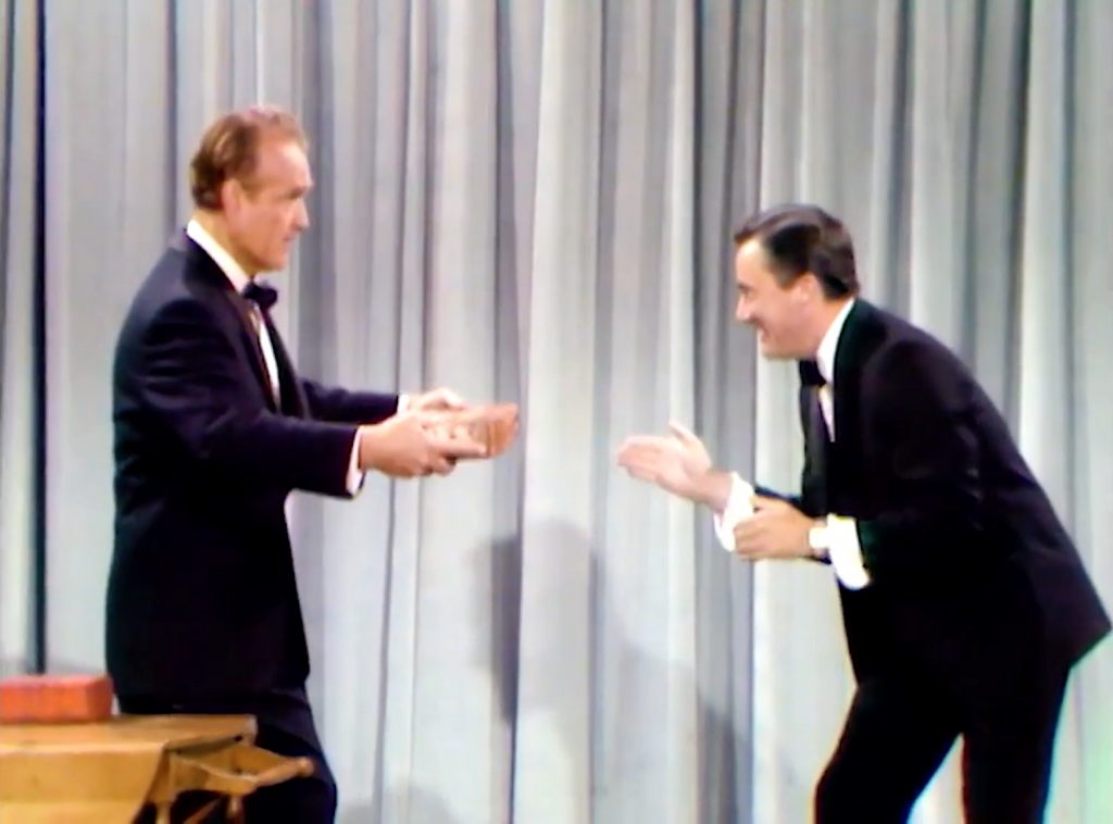 On Stage - Robert Vaughn demonstrates karate chops to Red Skelton