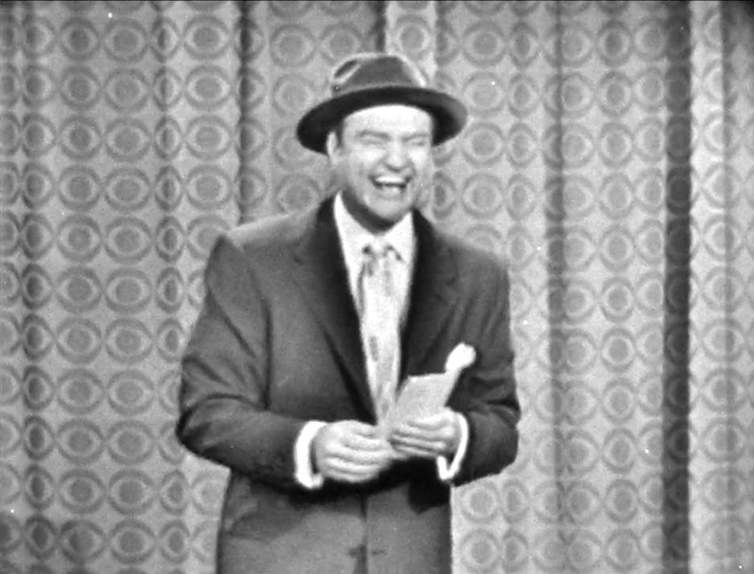 Red Skelton laughing during his monolog