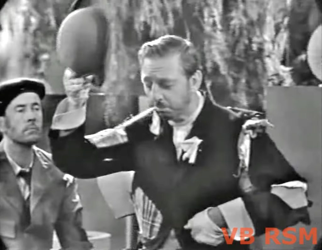 The Mayor of Central Park (Ray Bolger) greets his constituents