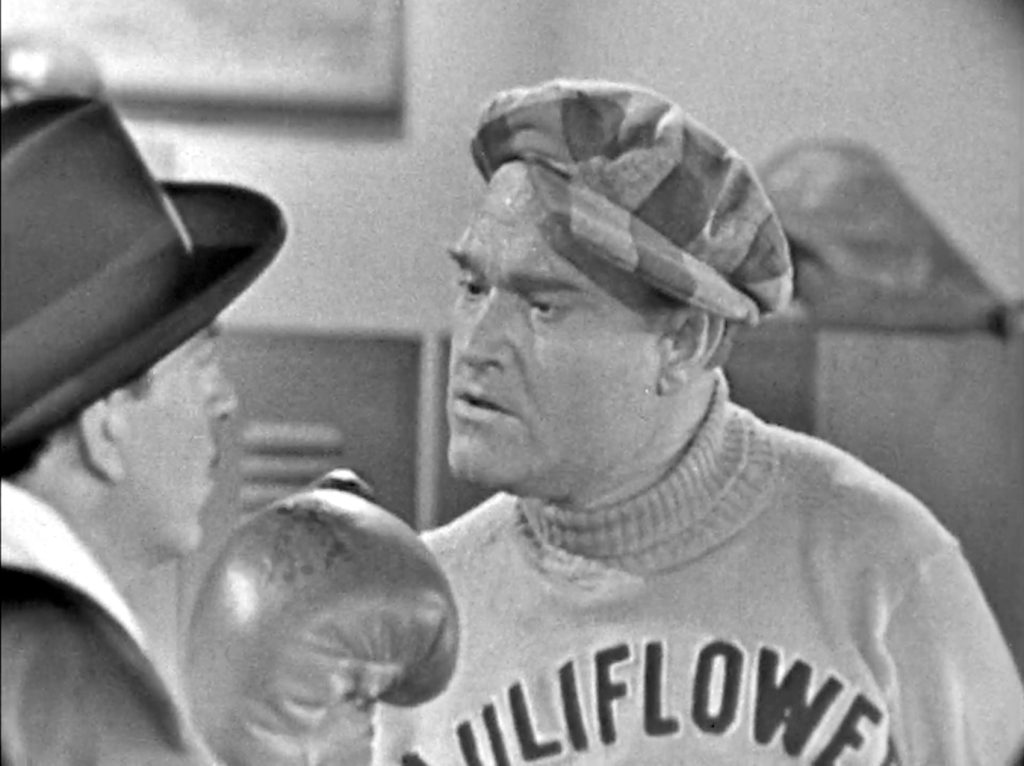 Cauliflower McPugg stands up to the kidnapper, Minelli