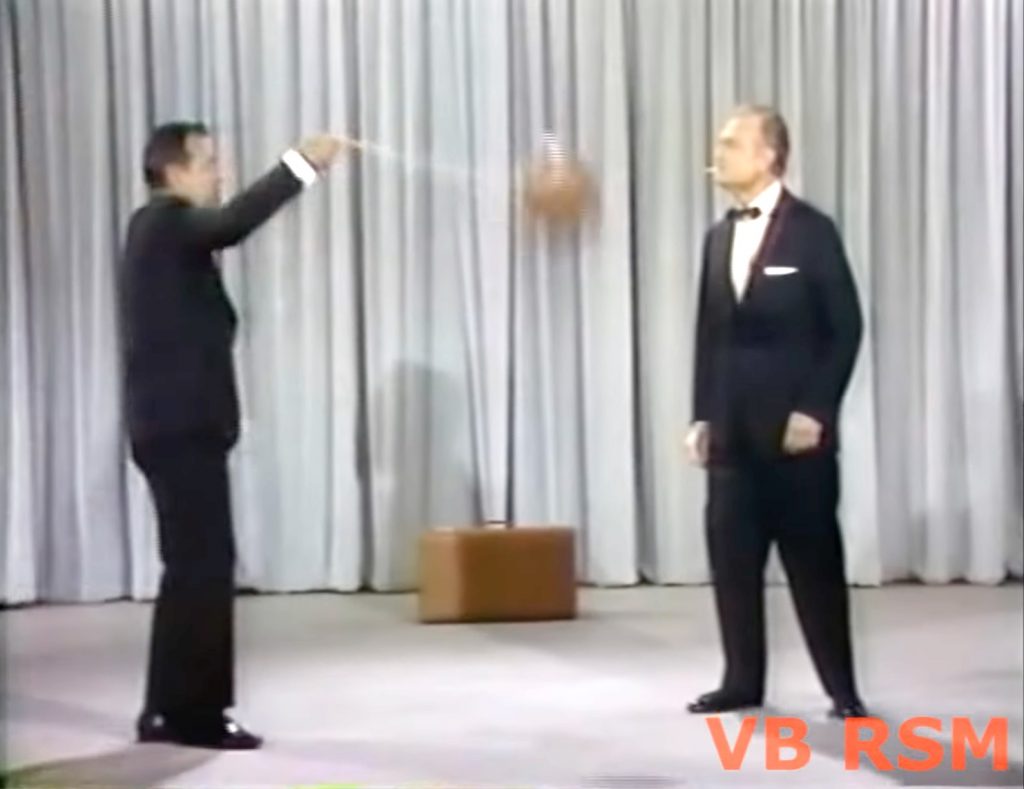 Tennessee Ernie Ford demonstrates his new game to Red Skelton