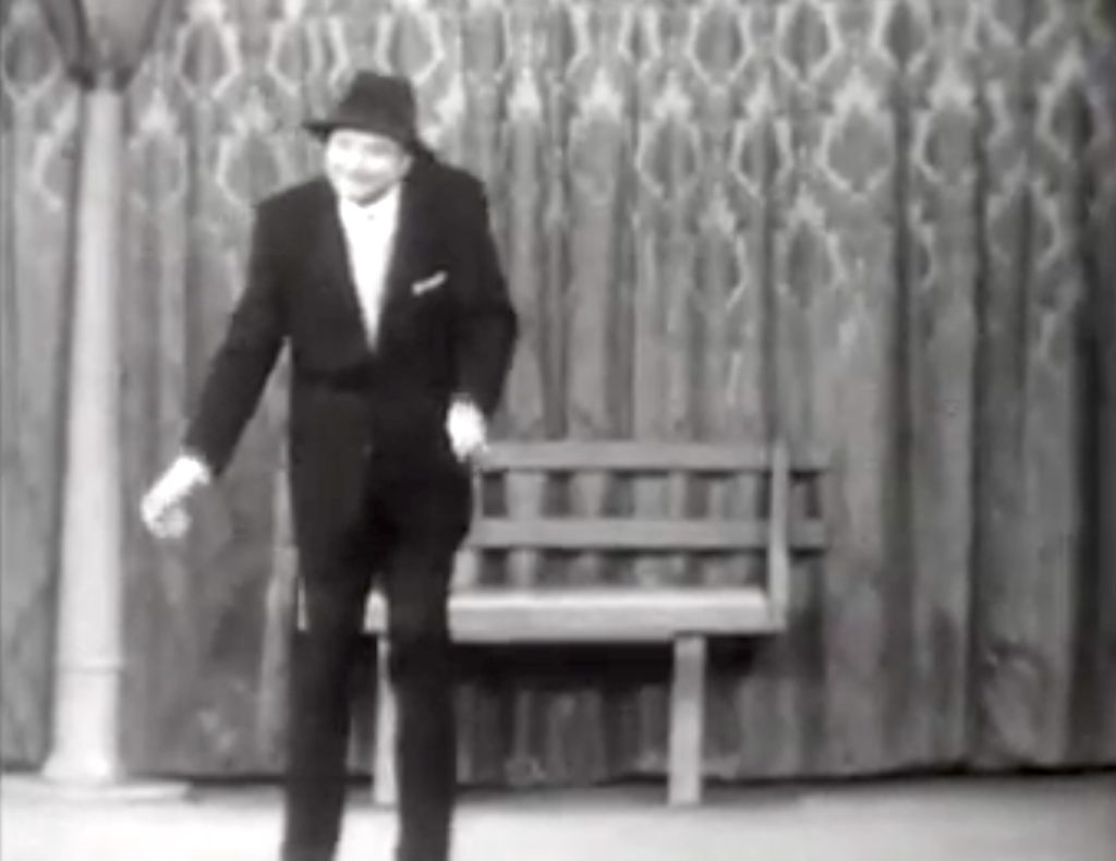 Red Skelton pantomiming a grandfather
