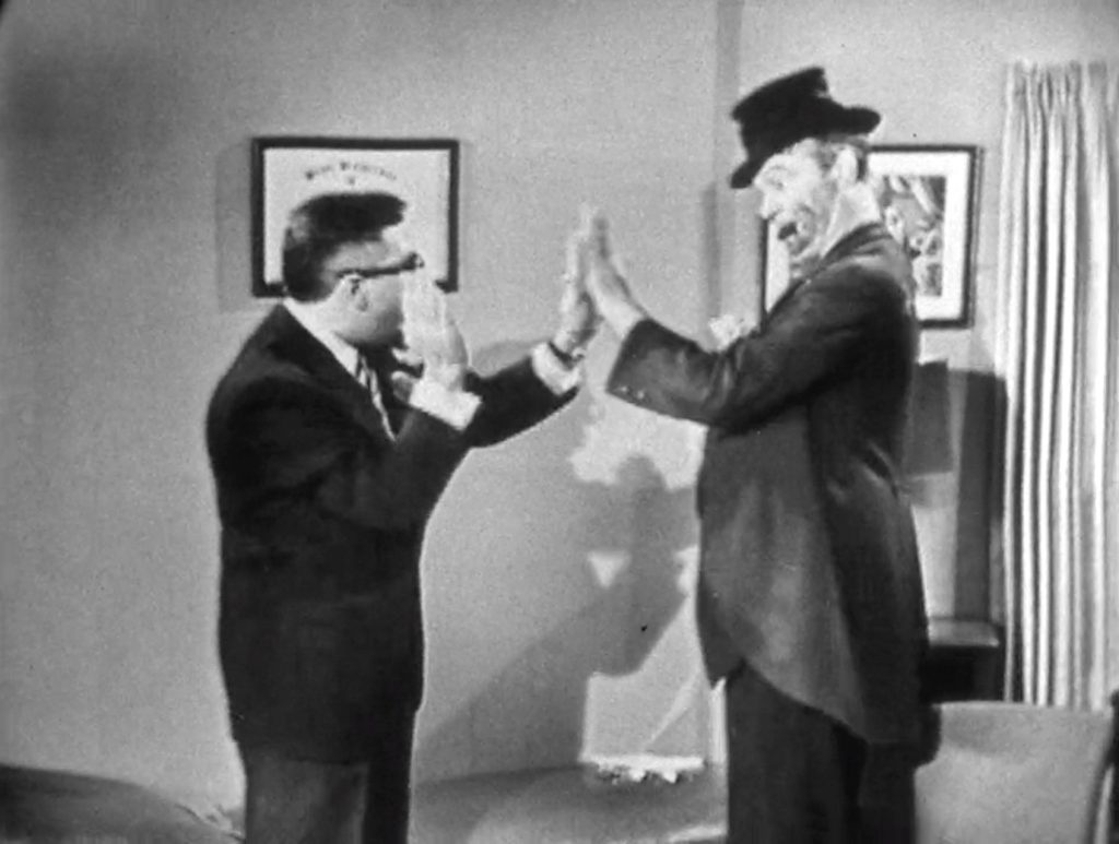 Freddie the Freeloader playing patty cake with the doctor - shortly before the doctor's taken away!