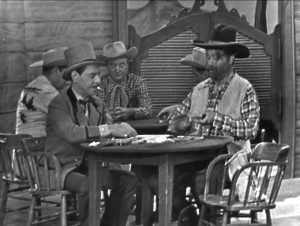 Deadeye plays poker with Riverboat Charlie in "The Big Trial"