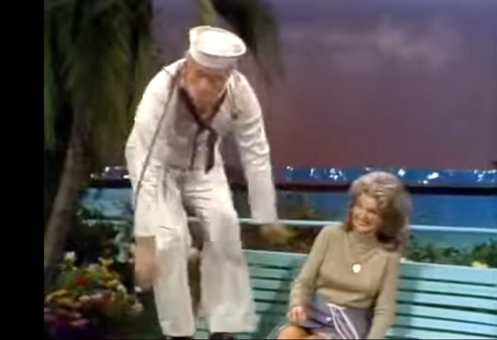 Sailor Red Skelton acts as the organ grinder's monkey, amusing Chanin Hale