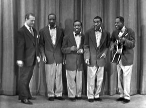 Red Skelton on stage with The Four Knights