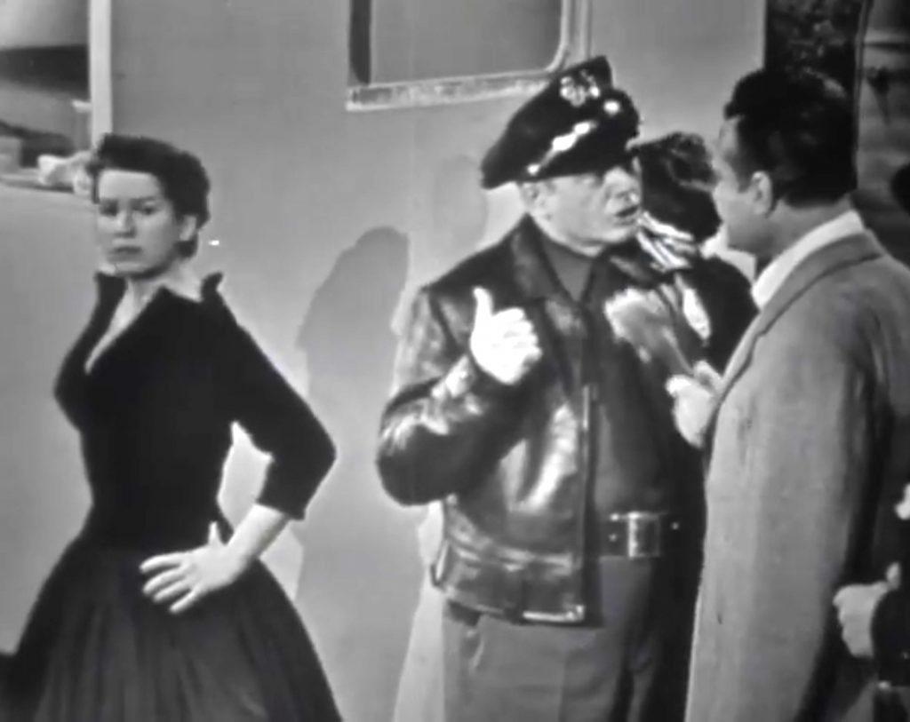 Sadie Murphy (Mary McCarty) is quite pretty when cleaned up … and she and the police officer know each other!