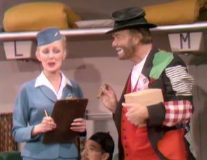 Selma Undercover (Virginia Grey) and Freddie the Freeloader (Red Skelton) on board the plane in The Sweet Smell of Failure