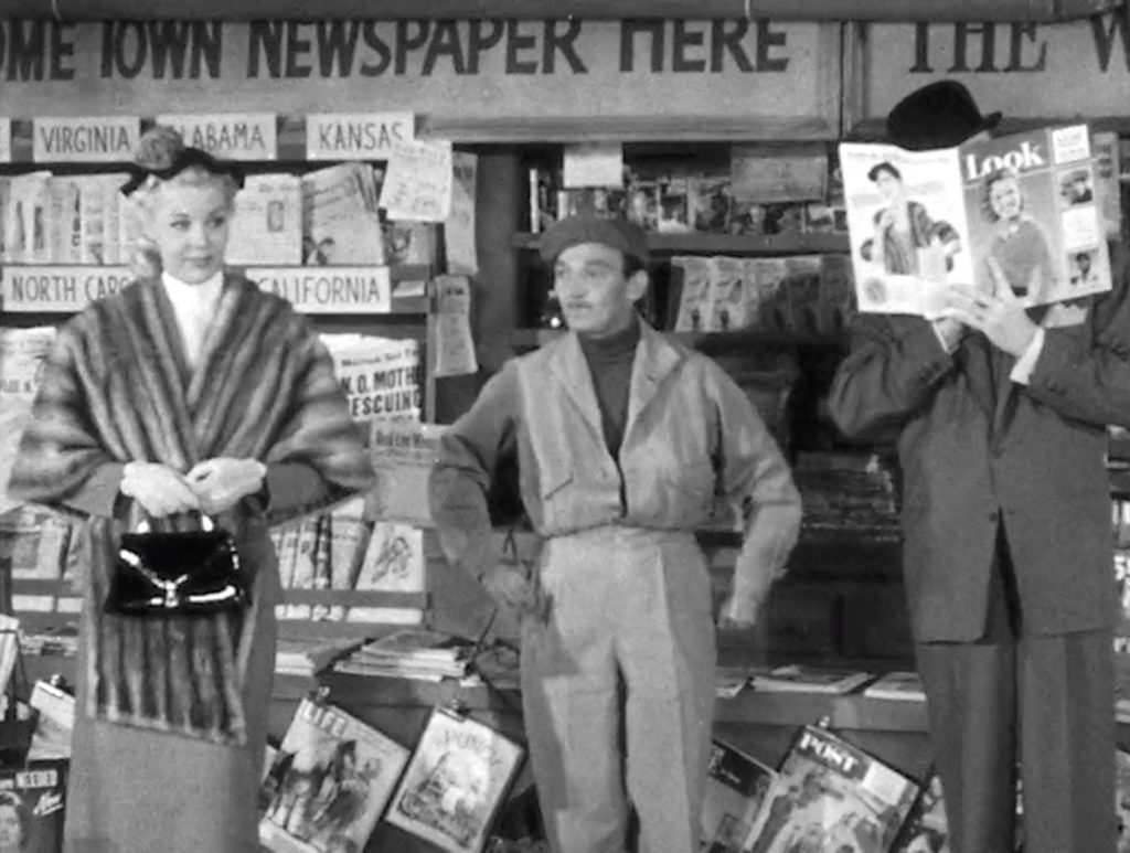 Pretty Lucy Knoch at the magazine stand, Red Skelton pretends to pay no attention