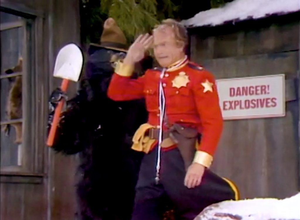 Finding a bear, RCMP Red Skelton turns him into Smokey the Bear!