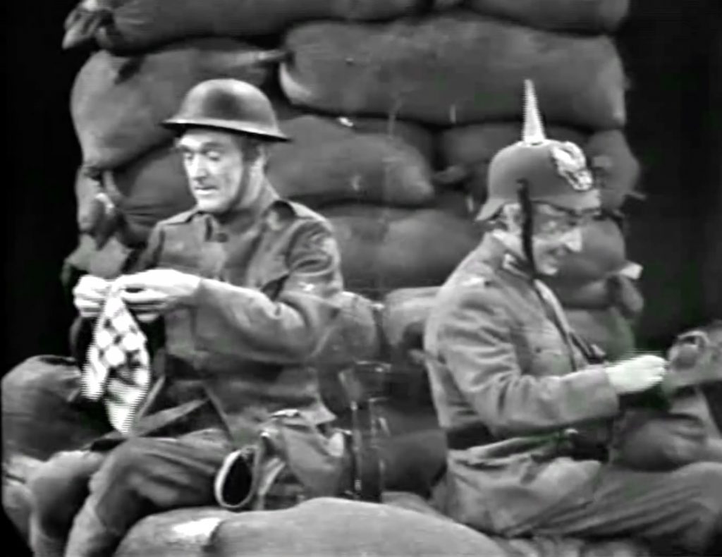 American soldier Red Skelton, back to back with German soldier Harpo Marx, in World War I - in the Silent Spot, "Christmas Truce"