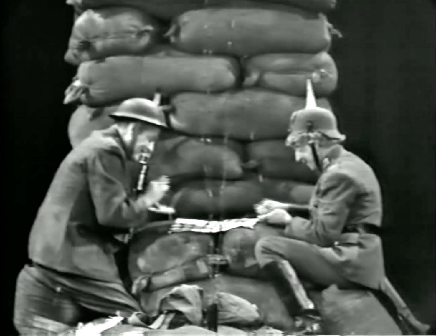 Soldiers Red Skelton and Harpo Marx, on opposite sides, play checkers