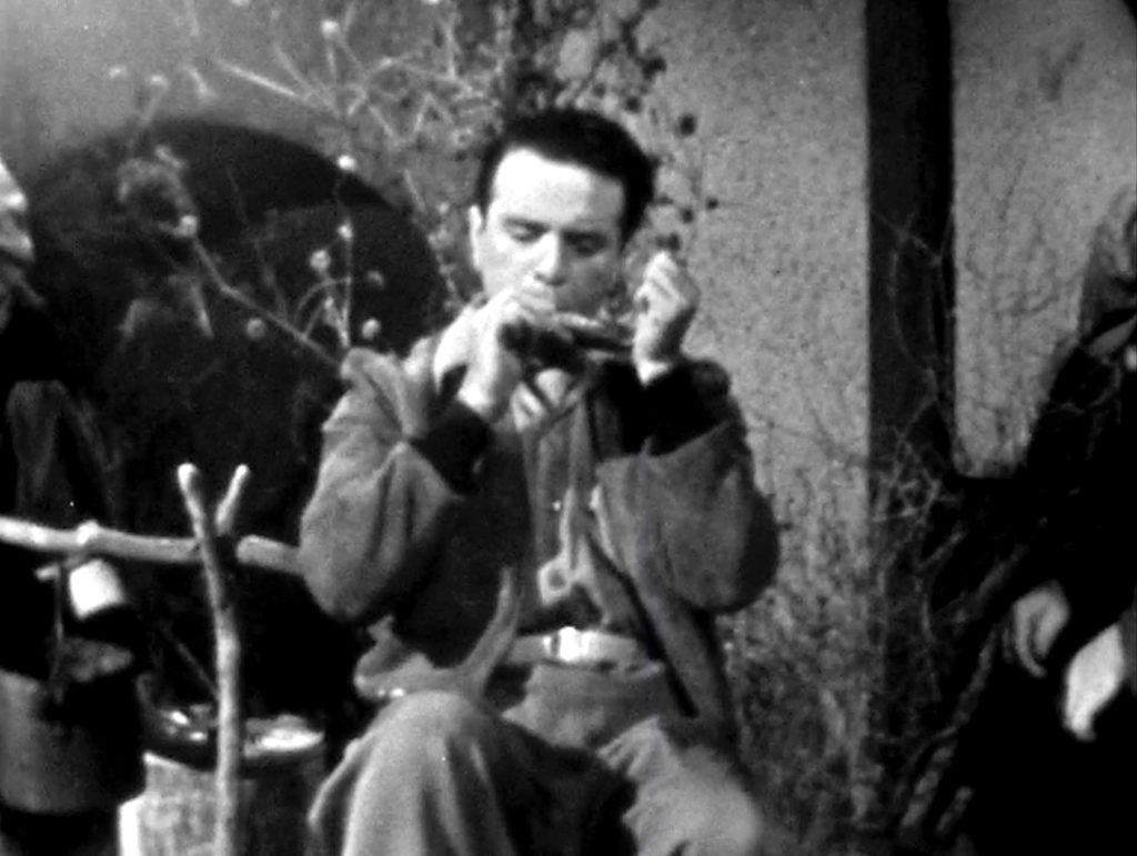 Hobo plays "Stormy Weather" on his harmonica