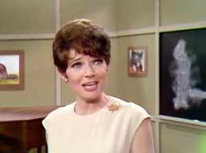 Suzy Suey (Polly Bergen), the hog calling teacher at Pig University